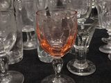 a lot of wine glasses that are on a table