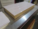 a stack of books sitting on top of a metal counter