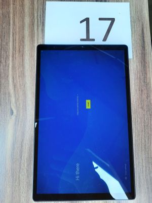 an image of a tablet computer sitting on top of a wooden table