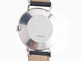 an image of a close up of a wrist watch on a white surface