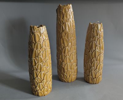 three vases that are sitting on a table
