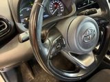 a steering wheel and dashboard of a car in a car showroom