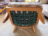 a chair that has a seat made out of wood