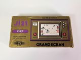 a game and watch sitting on top of a table