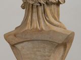 a marble bust of a woman with a wreath on her head