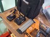 two tools on a table with a bag on it