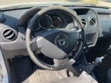 dashboard view of a car with a steering wheel and dashboard controls