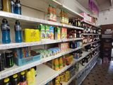 many different types of beverages on the shelves in the store