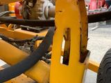 a close up of a machine with a hose attached to it