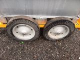 two wheels that are attached to a cart