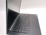 a laptop computer sitting on a table with a keyboard
