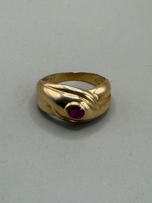 an image of a gold ring with a ruby stone