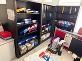 a desk with a lot of files and papers on it