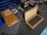 a small typewriter sitting on a counter next to a box of cigars
