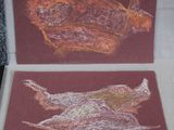 two cards with a drawing of a bird on them