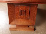a close up of a wooden table with a clock on it