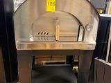 a large metal oven sitting in the middle of a room