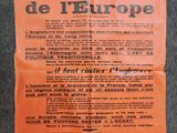 an orange poster with black writing on it on a blue background
