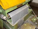 a machine that is working on a piece of paper