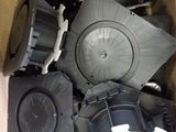 a cardboard box full of different types of speakers
