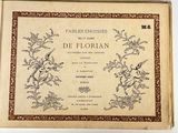 an old book with a picture of a bird and flowers on it