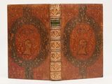 an old book with a picture of a woman on the cover
