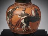 a vase with a picture of a man riding a horse on it