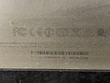 a close up of a metal plate with a barcode on it