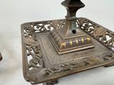 a metal tray with a candle on top of it
