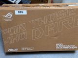 a box that is sitting on the floor next to a keyboard
