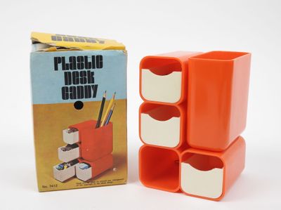 an orange plastic desk caddy with four drawers and a box of pencils