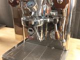 an image of a coffee machine on a wooden table