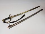 two old swords are sitting next to each other on a table