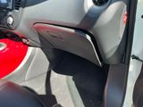 the interior of a car with the door open showing the dashboard and steering wheel