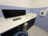 an image of a room with a tv and a chair
