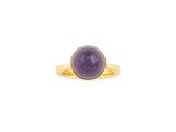 a gold ring with a purple stone in the center