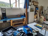 a workbench with tools on it in a room