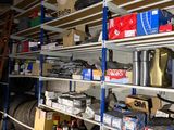 many shelves with various items on them in a room