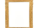 an antique gold frame with a white background