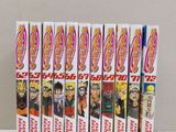 seven dragon ball dvds are lined up on a white table