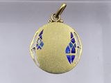 an image of a gold pendant with a blue butterfly on it