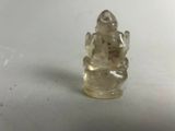 une image représentant une petite figurine en verre représentant un Bouddha