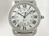 a silver wrist watch with roman numerals on it