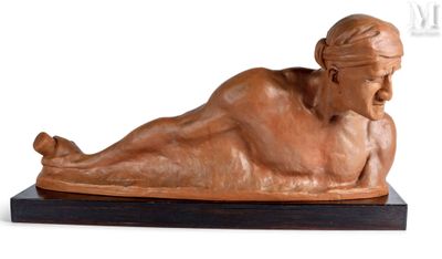 statue of a woman laying on her stomach on a wooden base