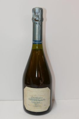 a bottle of wine that is sitting on a table