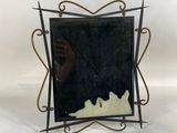 an image of a picture frame with a picture of a person in it