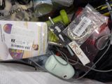 a bag full of items that are sitting on a bed