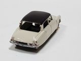 a toy car that is sitting on a white surface