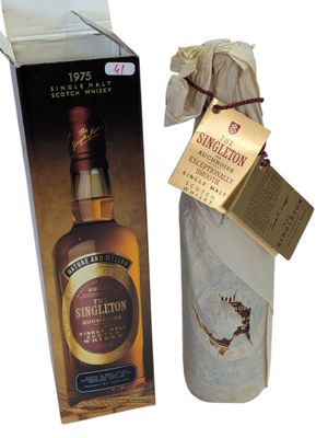 an image of a bottle of single malt whisky next to a package