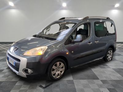 a picture of a small grey van parked in a garage